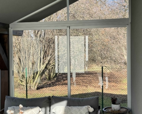 Detail zasklení šikmého štítu terasy systémem AluCombi v Petřvaldu